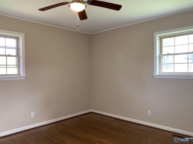 empty room with ceiling fan, dark hardwood / wood-style flooring, and ornamental molding