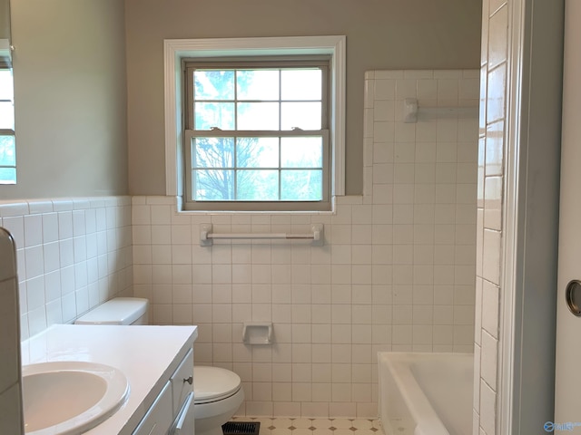 full bathroom with vanity, tile patterned floors, separate shower and tub, toilet, and tile walls