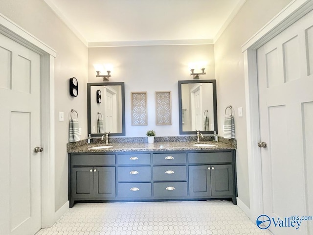 bathroom featuring vanity, tile patterned flooring, and ornamental molding