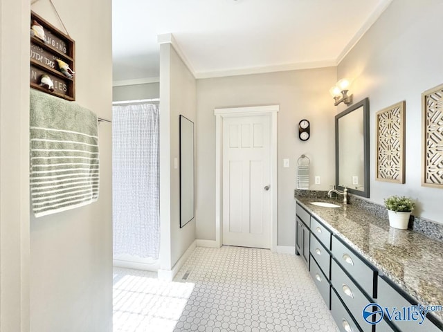 bathroom with vanity, a shower with shower curtain, and ornamental molding