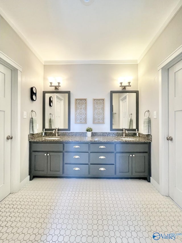 bathroom featuring vanity and ornamental molding