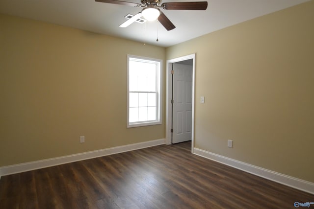 unfurnished room featuring ceiling fan and dark hardwood / wood-style flooring