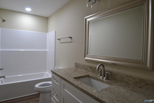 full bathroom with washtub / shower combination, vanity, toilet, and wood-type flooring