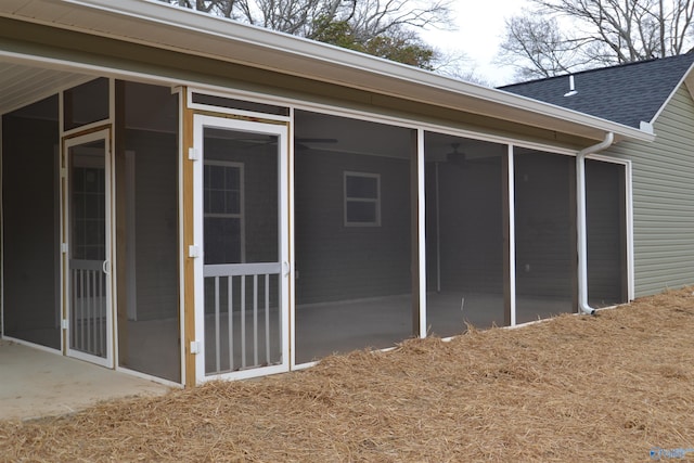 view of property exterior with a sunroom