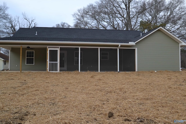 rear view of property with a yard