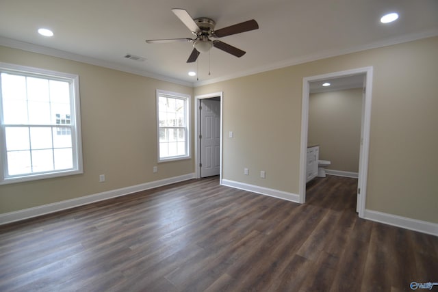 empty room with ornamental molding, dark hardwood / wood-style floors, and ceiling fan