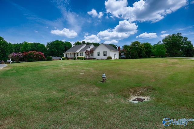 ranch-style house featuring a front lawn