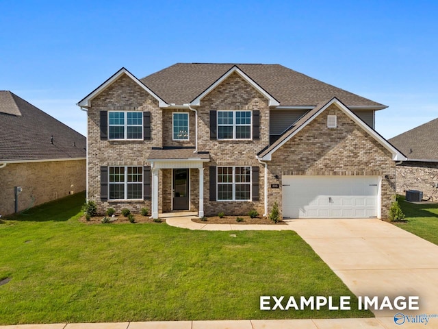 craftsman-style house featuring a garage, central AC unit, and a front yard