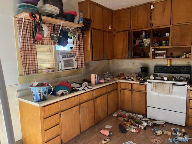 kitchen with white range with electric stovetop, light countertops, cooling unit, and open shelves