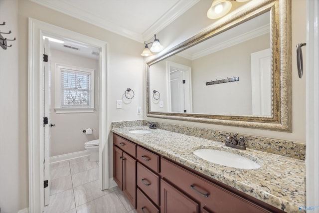 bathroom featuring vanity, crown molding, and toilet