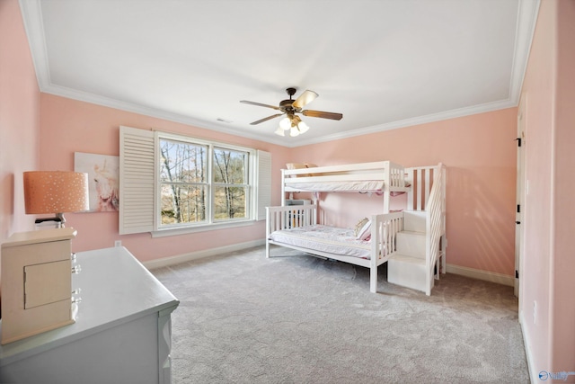 bedroom with crown molding, light colored carpet, and ceiling fan