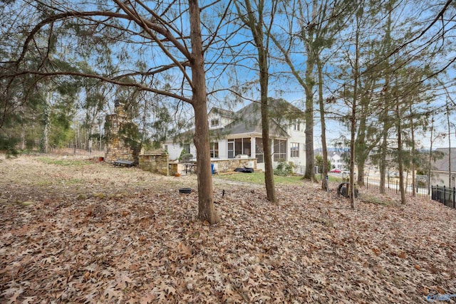 view of yard featuring a sunroom