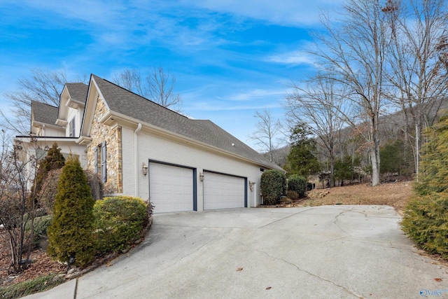 view of side of home with a garage