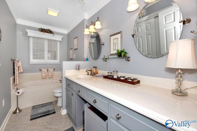 bathroom featuring crown molding, tile patterned flooring, a bathing tub, vanity, and toilet