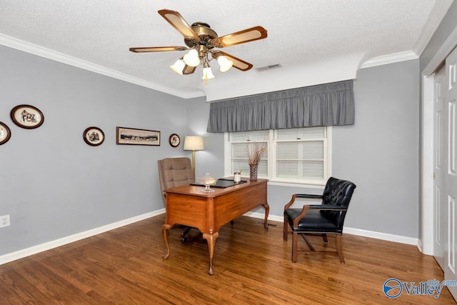 office area featuring wood-type flooring, a textured ceiling, ceiling fan, and crown molding