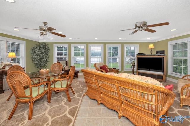 living room with ornamental molding, plenty of natural light, a textured ceiling, and light tile patterned floors