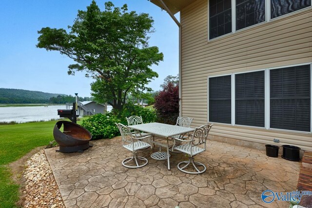 view of patio / terrace with a water view