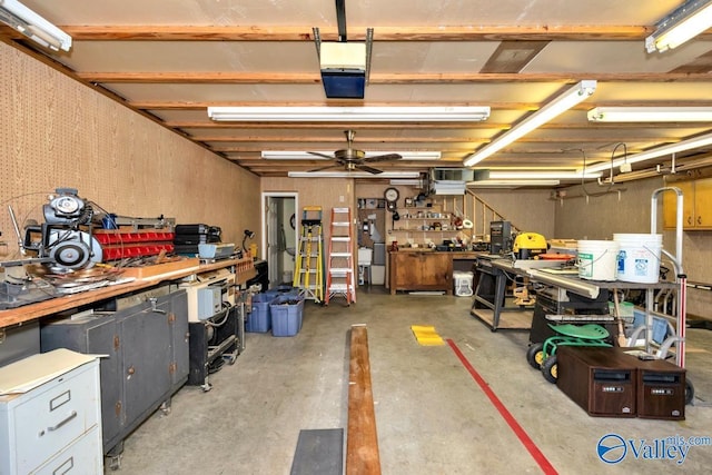 garage with ceiling fan and a workshop area