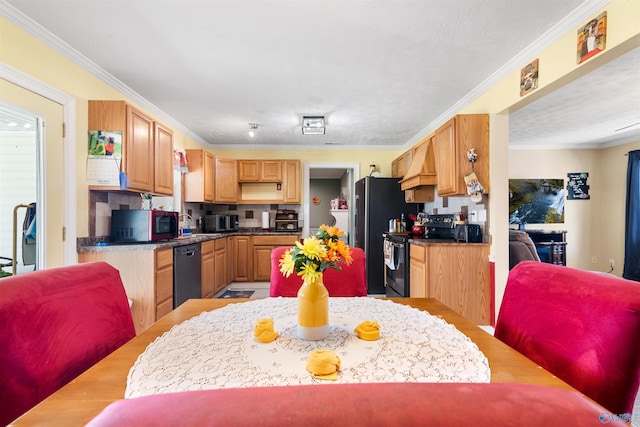 kitchen with light wood finished floors, dark countertops, ornamental molding, premium range hood, and black appliances