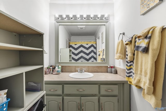 bathroom featuring ornamental molding, visible vents, and vanity