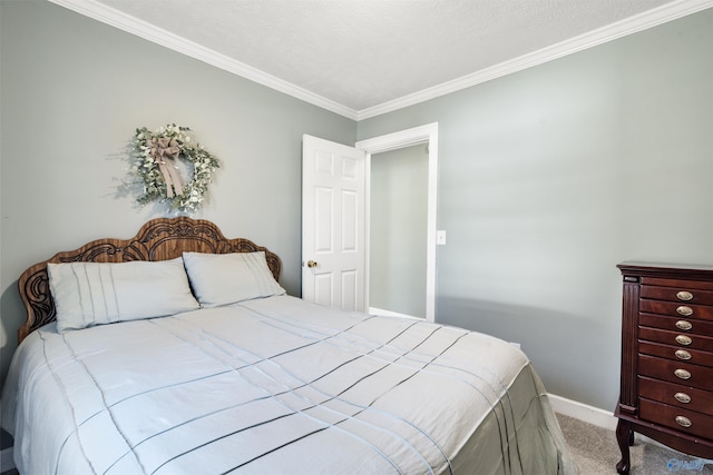 bedroom with a textured ceiling, ornamental molding, carpet flooring, and baseboards