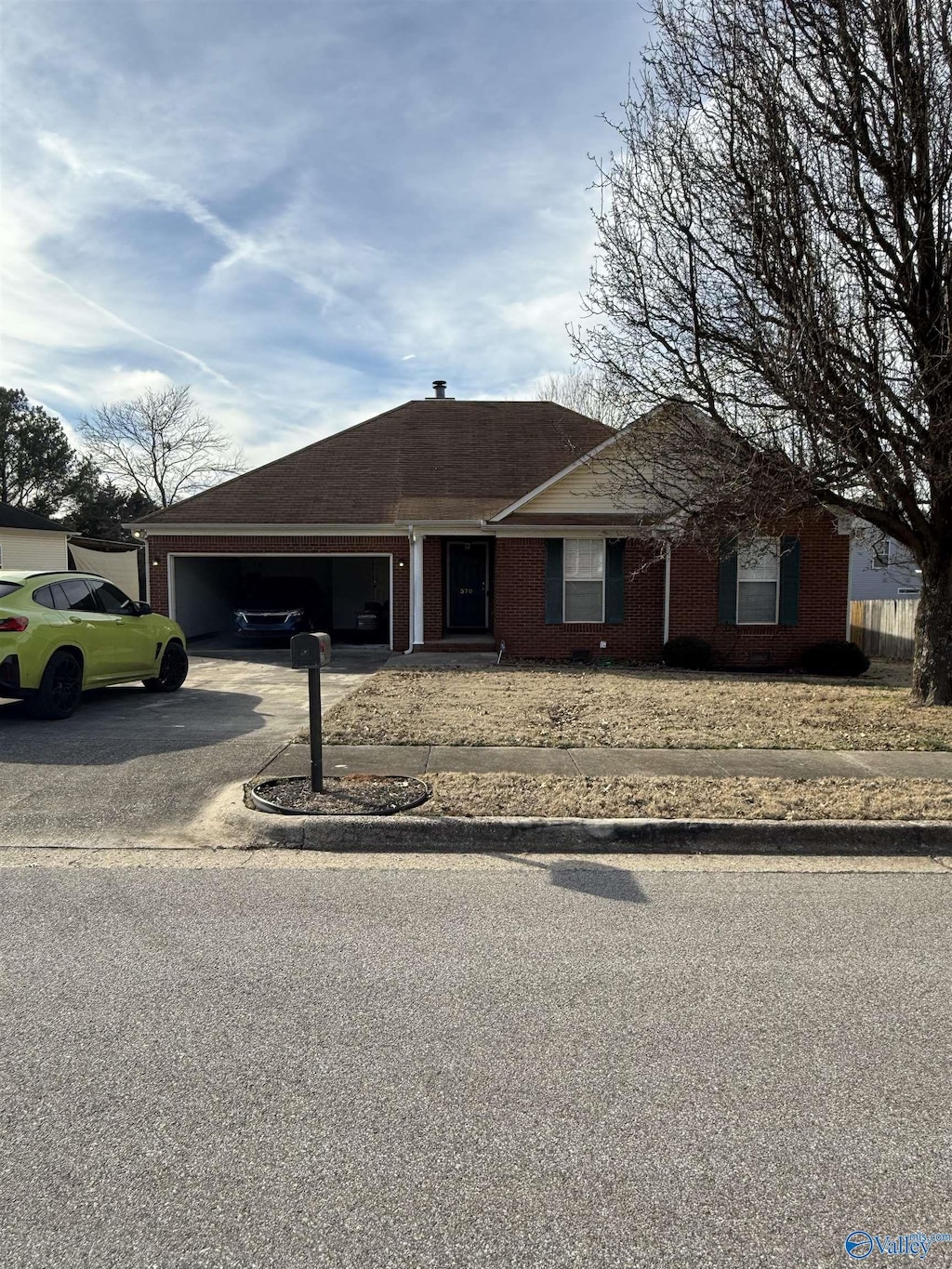 ranch-style house featuring a garage