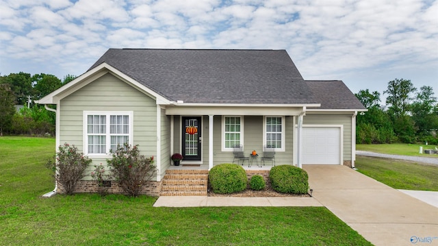 view of front of property with a front yard and a garage