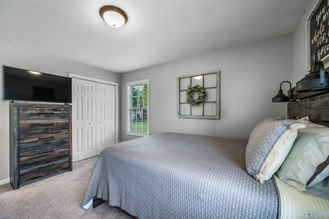 carpeted bedroom featuring a closet