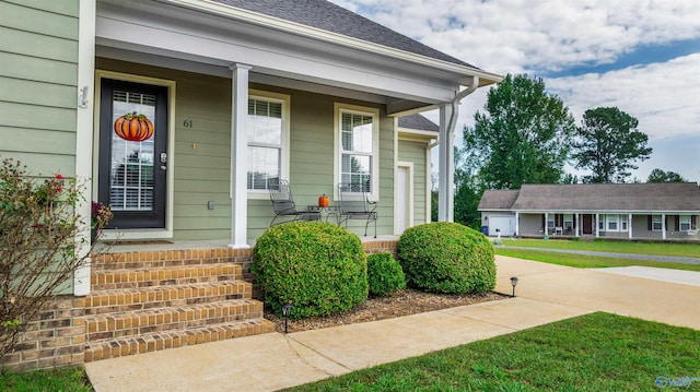 doorway to property featuring a porch