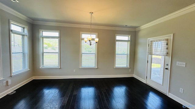 unfurnished dining area featuring a chandelier, dark wood finished floors, healthy amount of natural light, baseboards, and crown molding