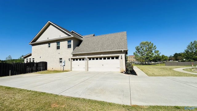 view of property exterior with brick siding, driveway, a garage, and a shingled roof