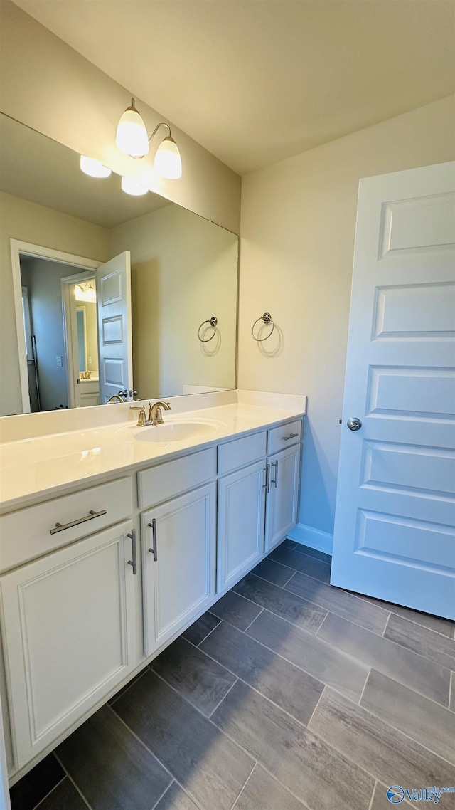 bathroom featuring vanity and wood finish floors
