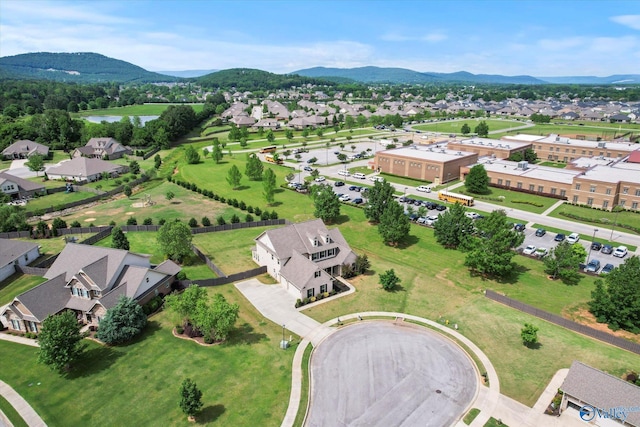 aerial perspective of suburban area with a water and mountain view