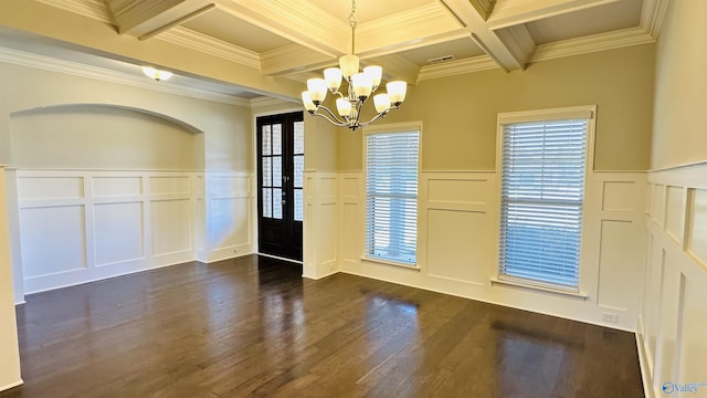 unfurnished dining area featuring a decorative wall, coffered ceiling, a chandelier, beamed ceiling, and dark wood-style flooring