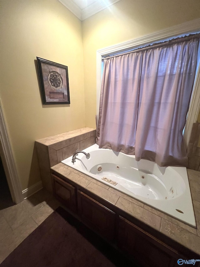 bathroom featuring ornamental molding, a bath, and tile patterned floors