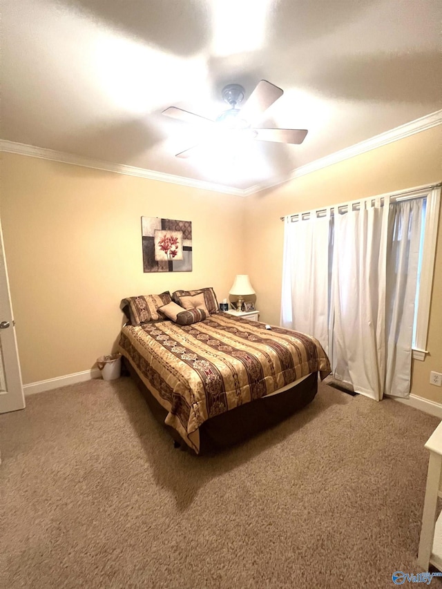 carpeted bedroom with ceiling fan and ornamental molding