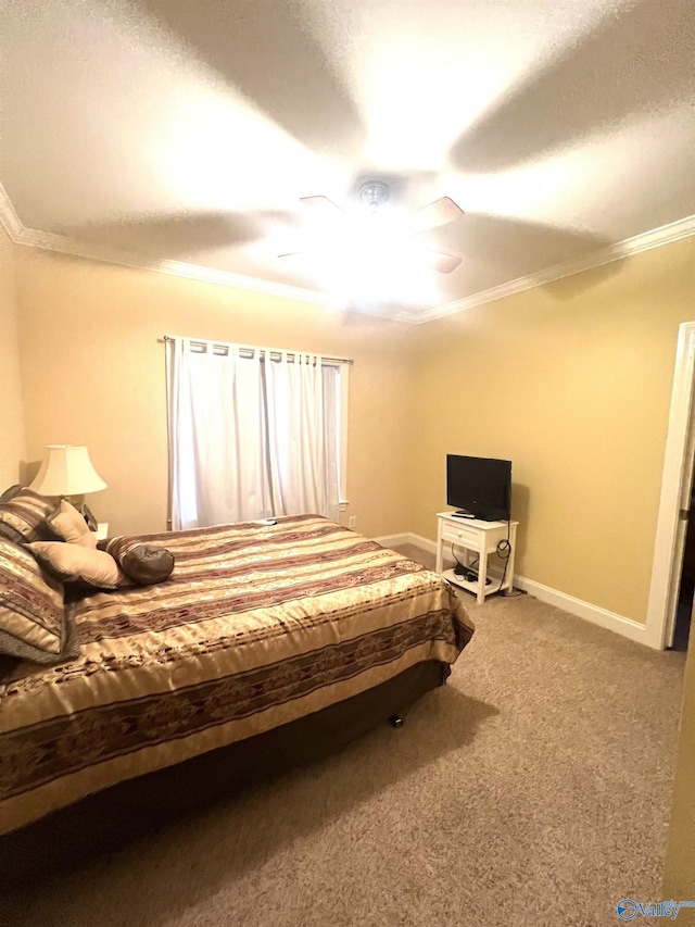 carpeted bedroom featuring ceiling fan and ornamental molding