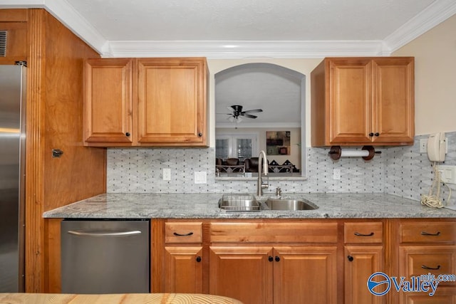 kitchen featuring sink, crown molding, ceiling fan, stainless steel appliances, and light stone countertops