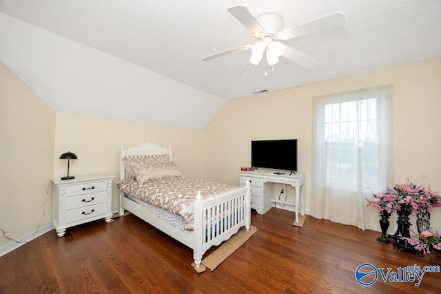 bedroom featuring vaulted ceiling, dark hardwood / wood-style floors, and ceiling fan