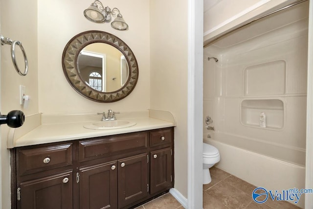 full bathroom featuring vanity, tile patterned floors, shower / washtub combination, and toilet