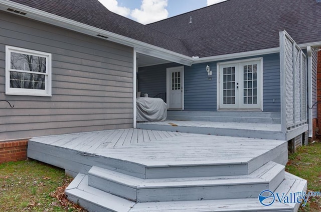 wooden deck featuring french doors