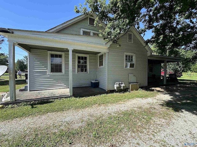 view of side of property featuring a porch