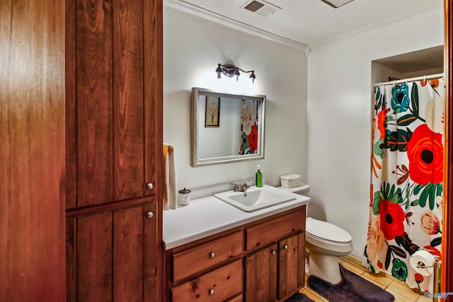 bathroom with tile patterned flooring, a textured ceiling, crown molding, vanity, and toilet