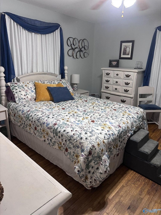 bedroom with ceiling fan and wood finished floors