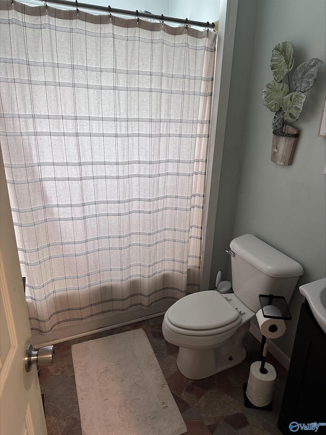 bathroom with toilet and shower / bath combination with curtain