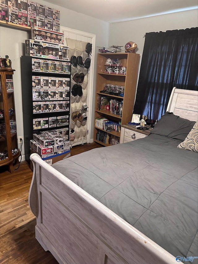 bedroom featuring wood finished floors