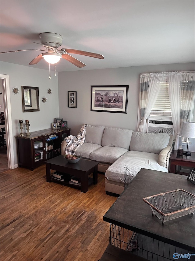 living room featuring a ceiling fan and wood finished floors