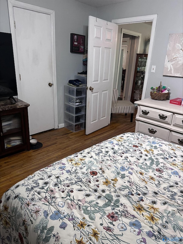 bedroom with wood finished floors