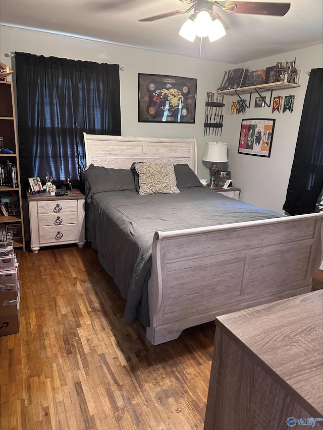 bedroom with ceiling fan and wood finished floors