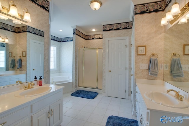 bathroom featuring a wealth of natural light, a stall shower, and a sink